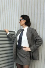 Double-breasted suit with a miniskirt, gray and red plaid